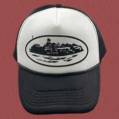 Cortiez Bold Black Oval Ship Logo Trucker Hat - White