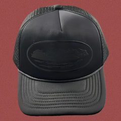 Cortiez All-Black Monochromatic Oval Ship Logo Trucker Hat